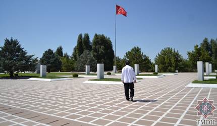 In chef whites on the flag-lined ceremonial plaza of the Turkish State Cemetery